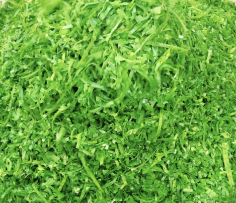 A close-up mound of finely chopped bright green onion tops